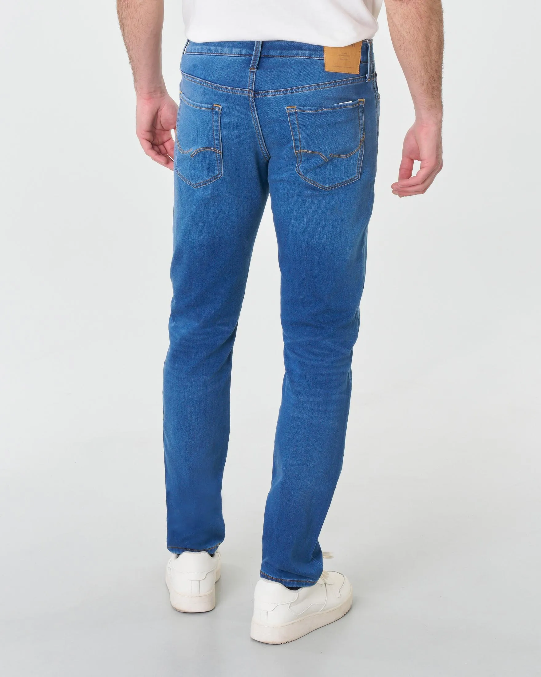 Jeans slim-fit a vita bassa in cotone stretch lavaggio medio stone washed con baffature